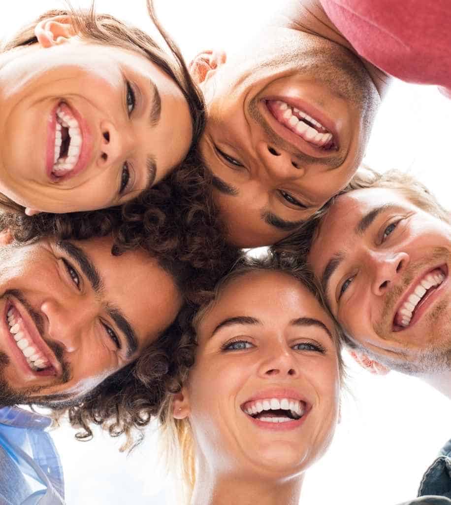 Smiling person showcasing white teeth after laser whitening treatment Dudley